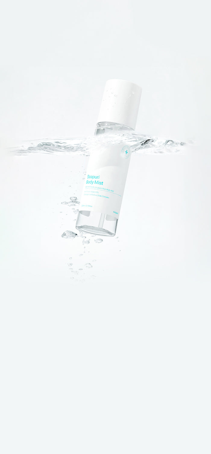 Seapuri Shavik body mist bottle submerged in water, highlighting the product's refreshing and hydrating qualities, captured against a clean, minimalist background.