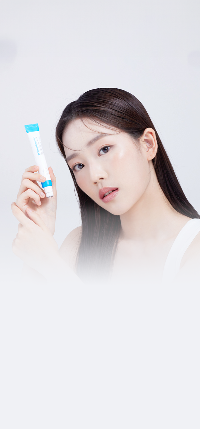 Young woman with clear skin holding a tube of Dr.33 Hair Ampoule, demonstrating the product's effectiveness in achieving a glowing complexion, set against a clean, minimalist background